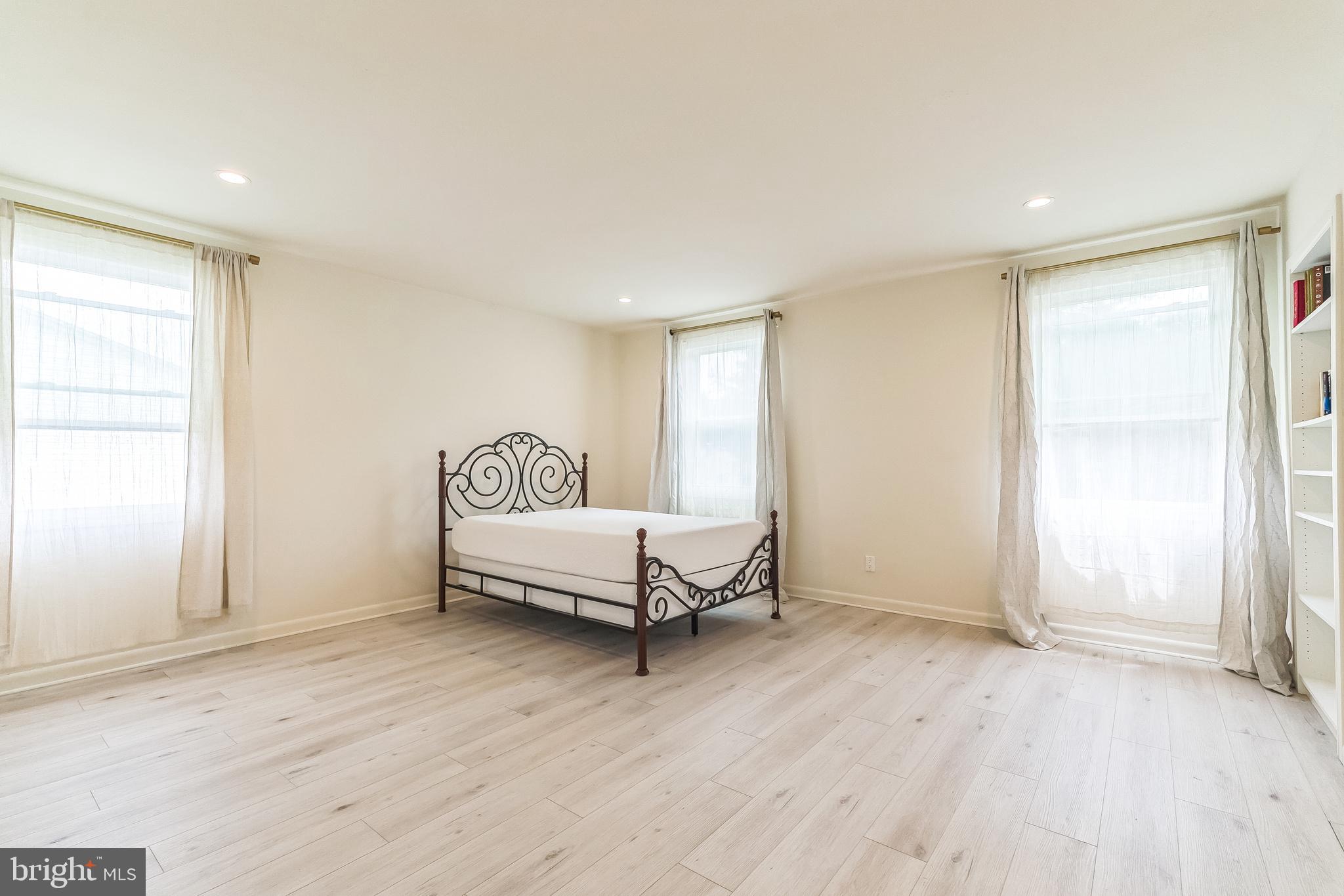 133 Lewis Road Havertown, PA 19083 - Photo 19 of 33 a living room with a bed furniture and a window
