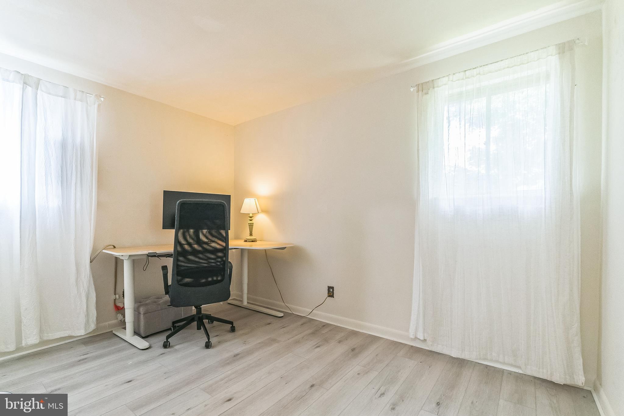 133 Lewis Road Havertown, PA 19083 - Photo 25 of 33 a view of workspace with wooden floor lounge chair and windows