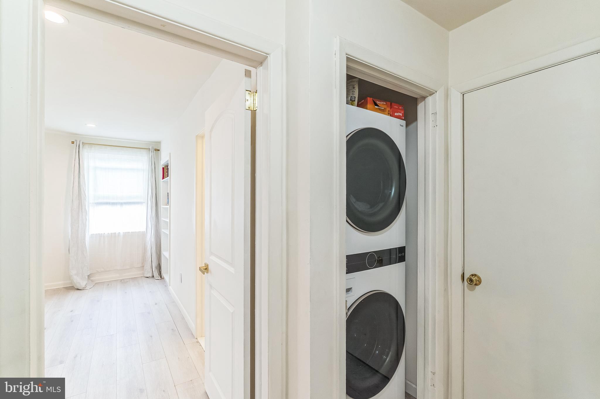 133 Lewis Road Havertown, PA 19083 - Photo 29 of 33 a view of a hallway with washer and dryer