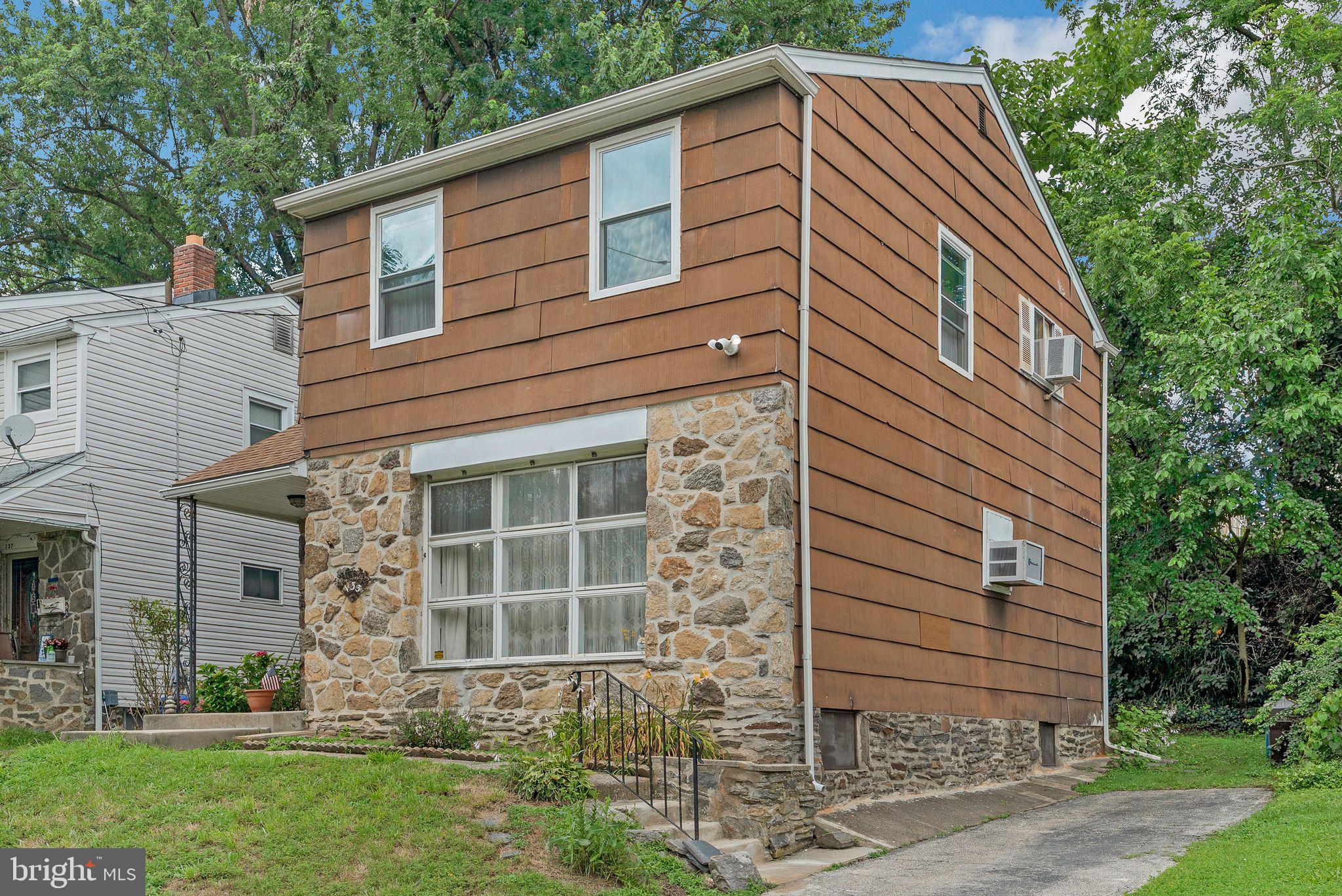 133 Lewis Road Havertown, PA 19083 - Photo 4 of 33 a front view of a house with a yard