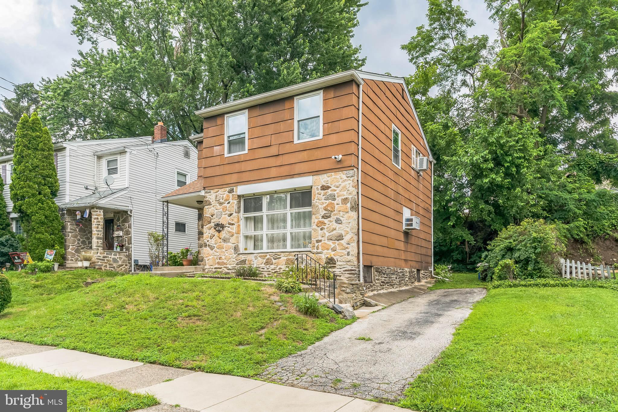 133 Lewis Road Havertown, PA 19083 - Photo 6 of 33 a front view of a house with a yard