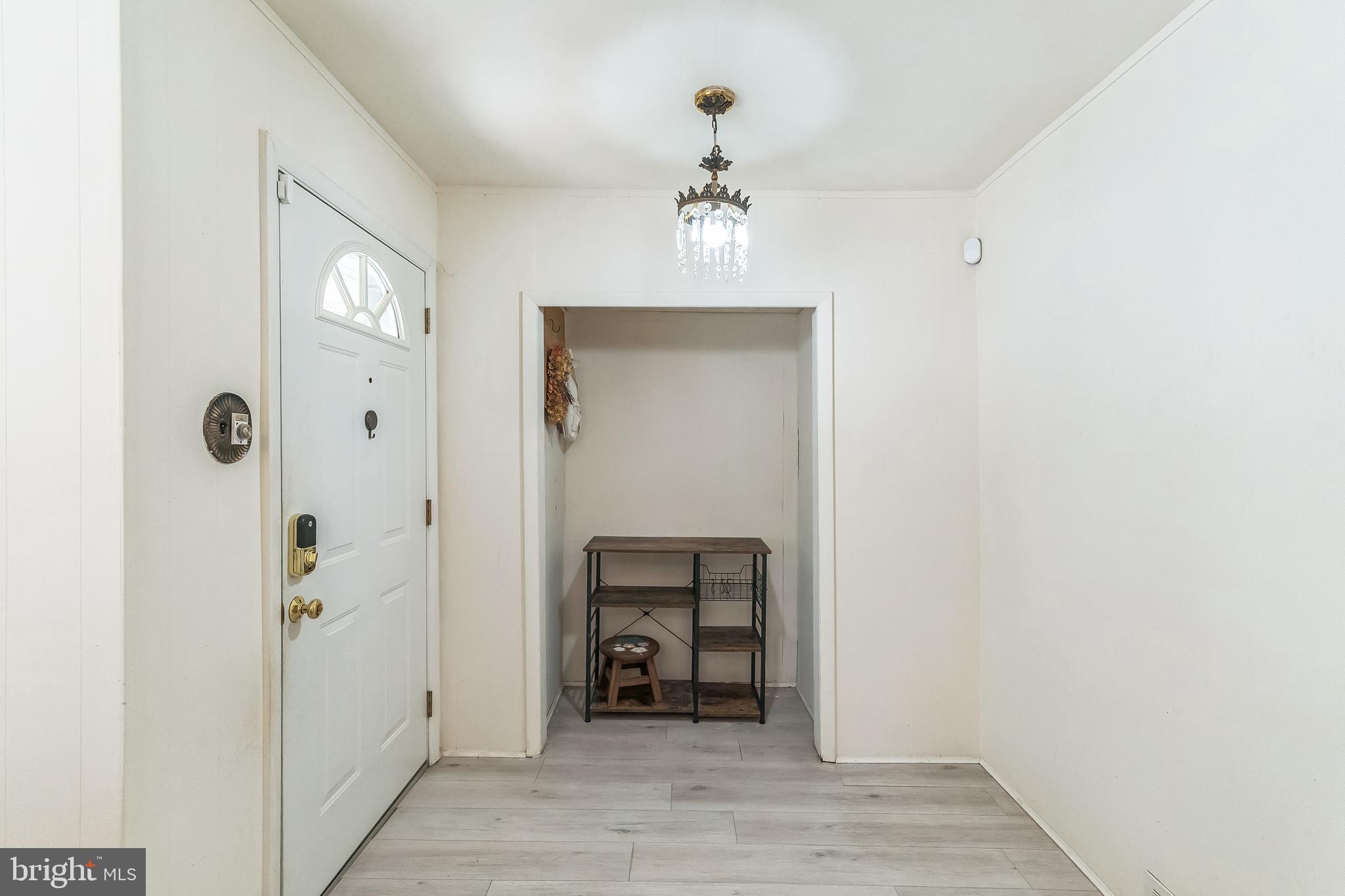 133 Lewis Road Havertown, PA 19083 - Photo 7 of 33 wooden floor in an empty room with a mirror
