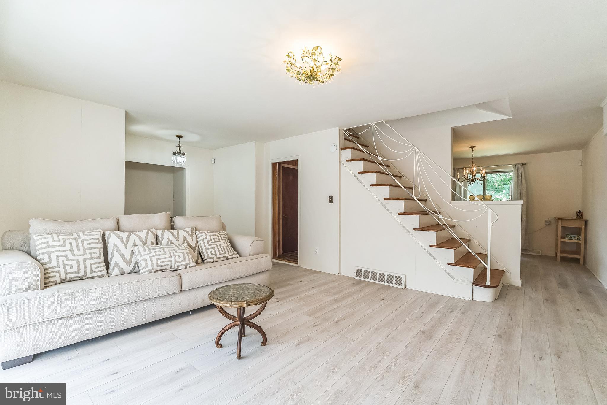 133 Lewis Road Havertown, PA 19083 - Photo 8 of 33 a living room with furniture and a wooden floor