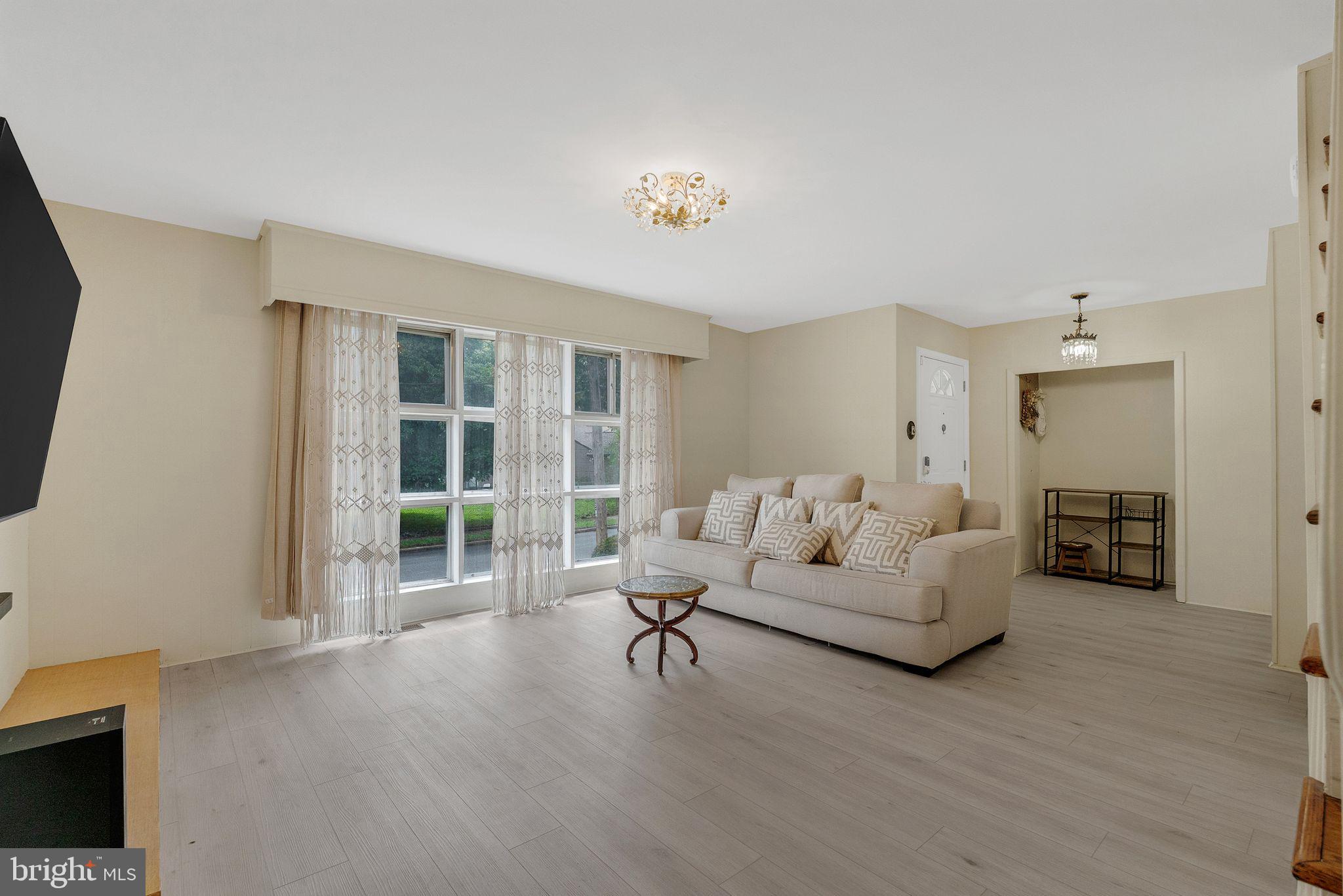 133 Lewis Road Havertown, PA 19083 - Photo 9 of 33 a living room with furniture and a flat screen tv