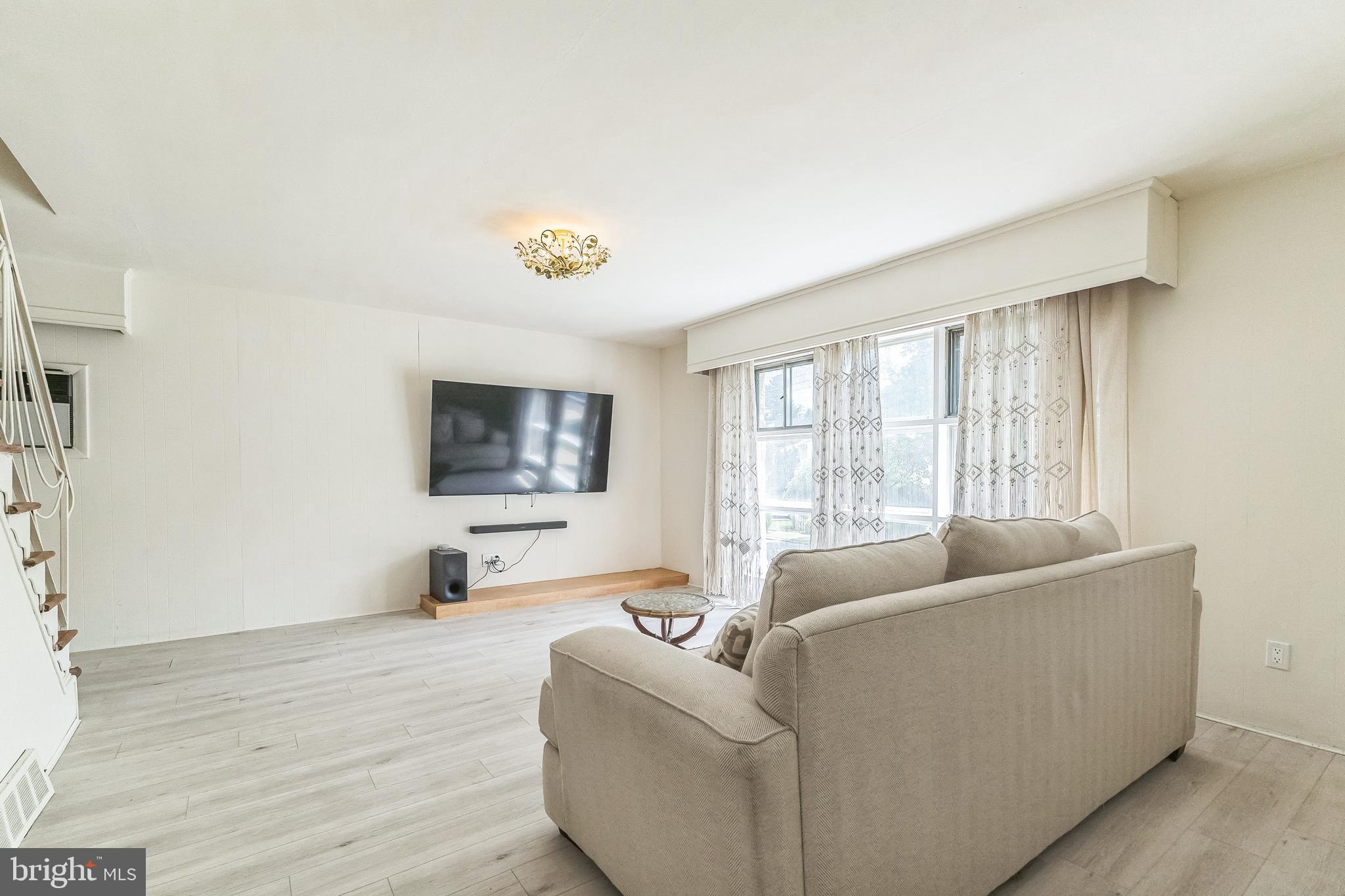 133 Lewis Road Havertown, PA 19083 - Photo 10 of 33 a living room with furniture and a flat screen tv