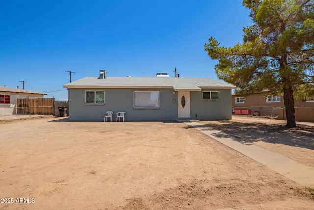 a view of a house with a snow in a yard