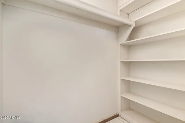 a view of an empty walk in closet