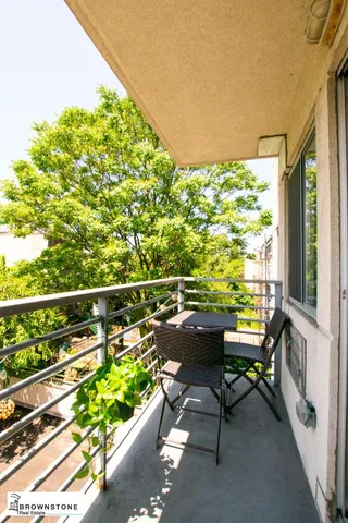 a balcony with chairs