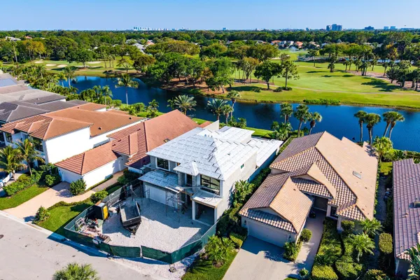 an aerial view of a house with garden space and houses