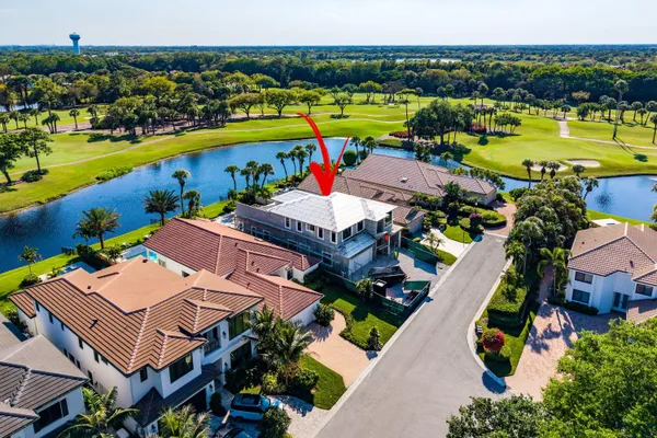 an aerial view of a house with a swimming pool yard and outdoor seating