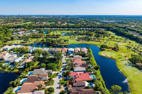an aerial view of residential houses with outdoor space