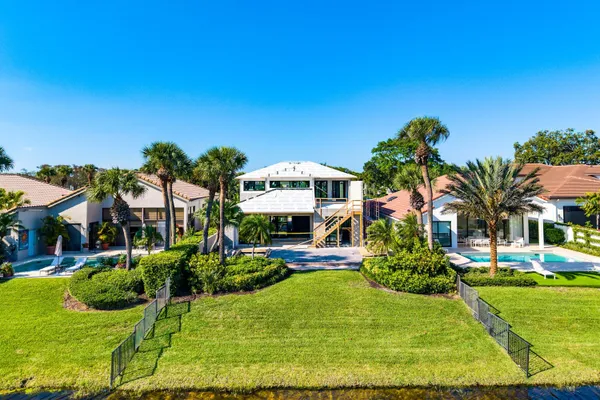 a view of an house with outdoor space and swimming pool
