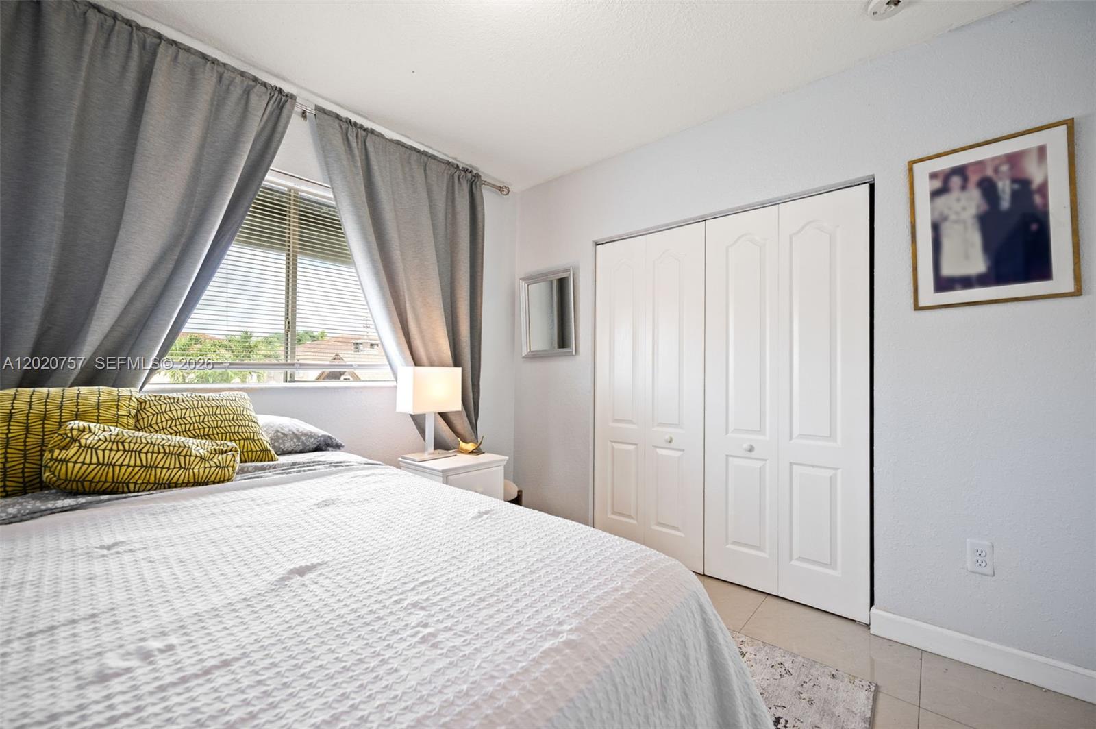 255 East 3rd Street, Unit 1 Hialeah, FL 33010 - Photo 21 of 38 a bedroom with a bed and a window