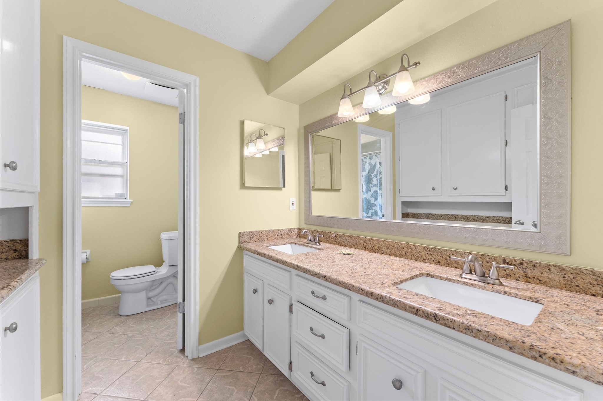 19415 Craigchester Lane Spring, TX 77388 - Photo 16 of 31 a bathroom with a granite countertop sink and a mirror