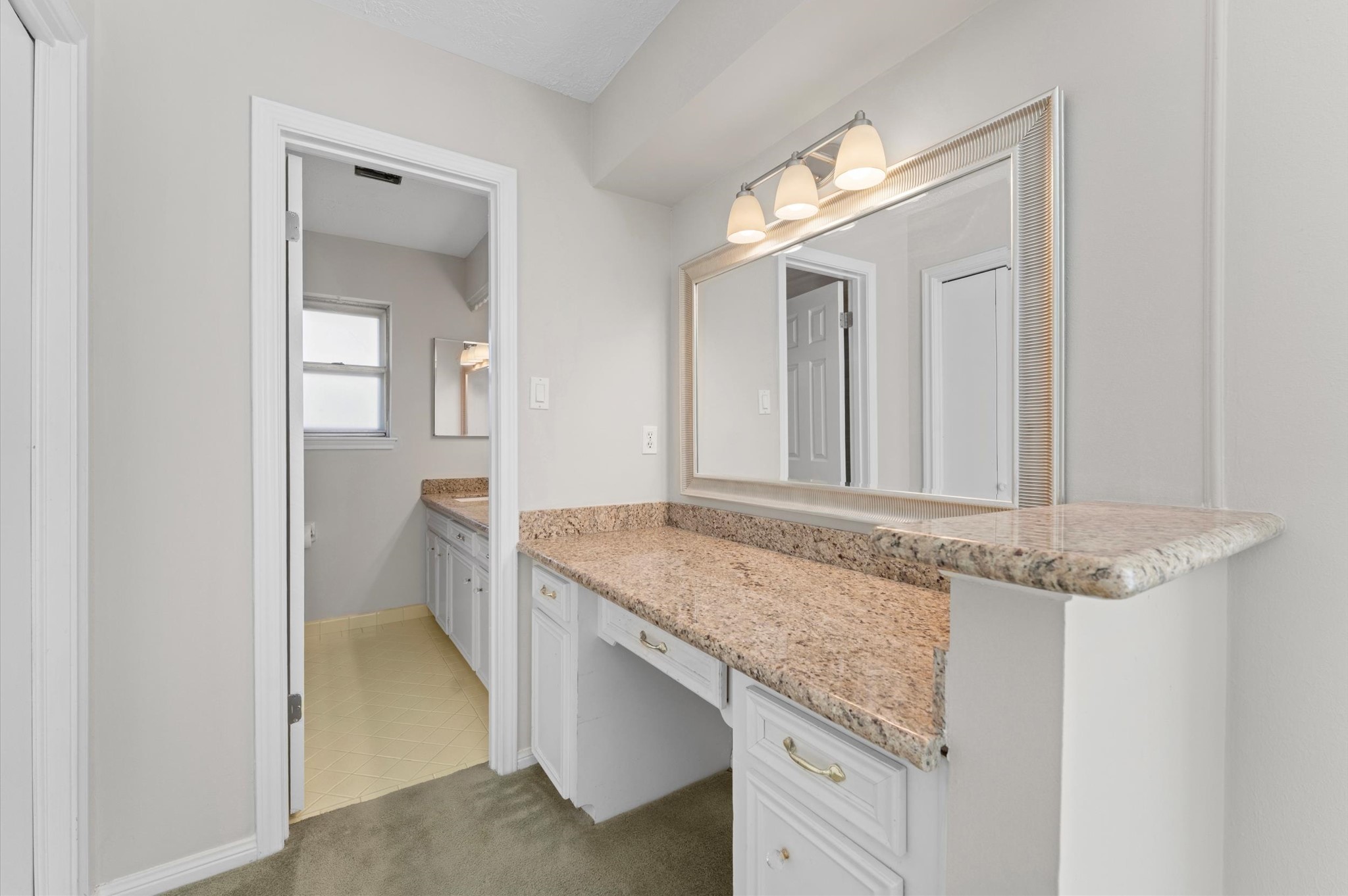 19415 Craigchester Lane Spring, TX 77388 - Photo 19 of 31 a bathroom with a granite countertop sink and a mirror