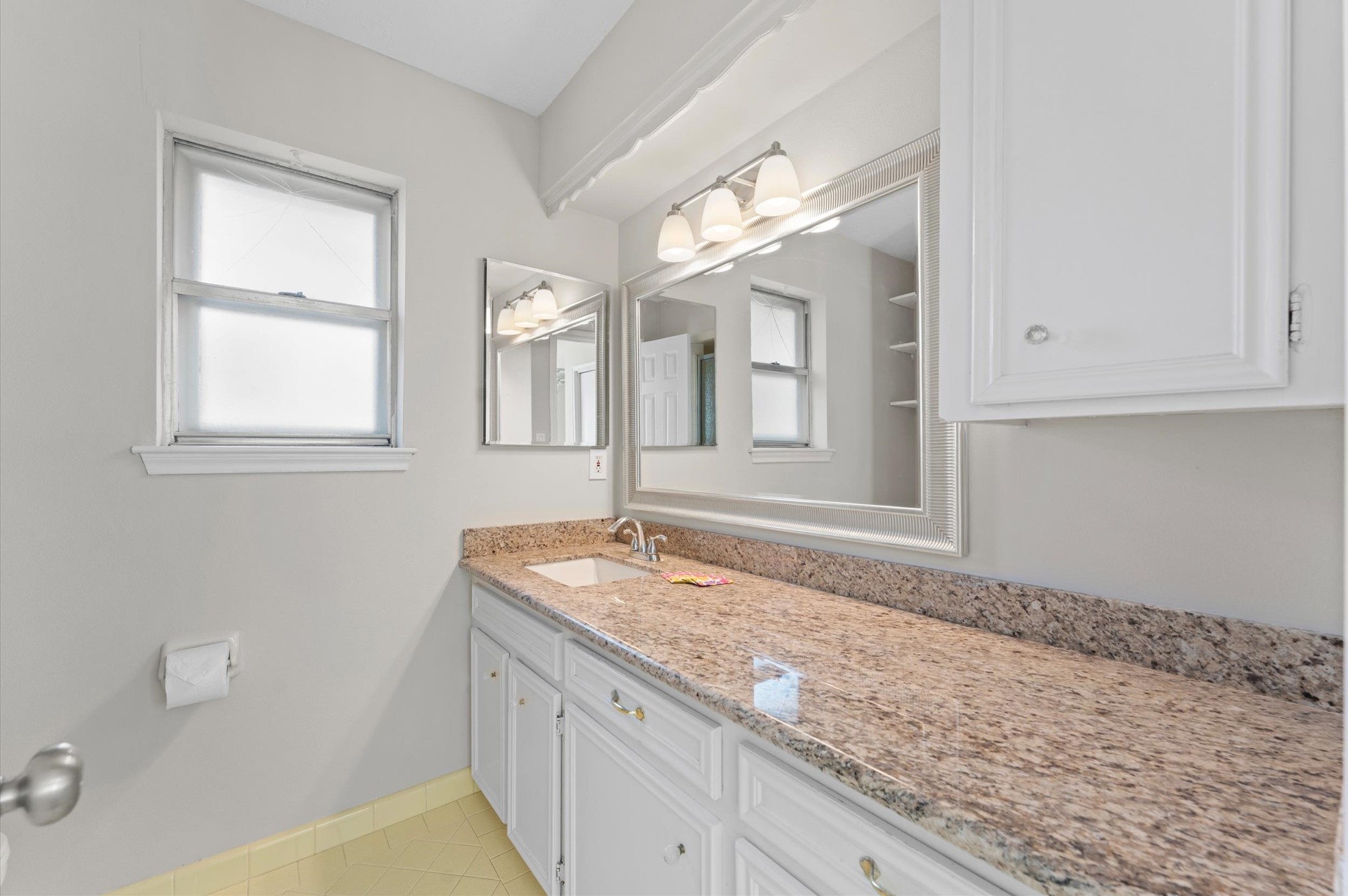 19415 Craigchester Lane Spring, TX 77388 - Photo 20 of 31 a bathroom with a granite countertop sink mirror and cabinets