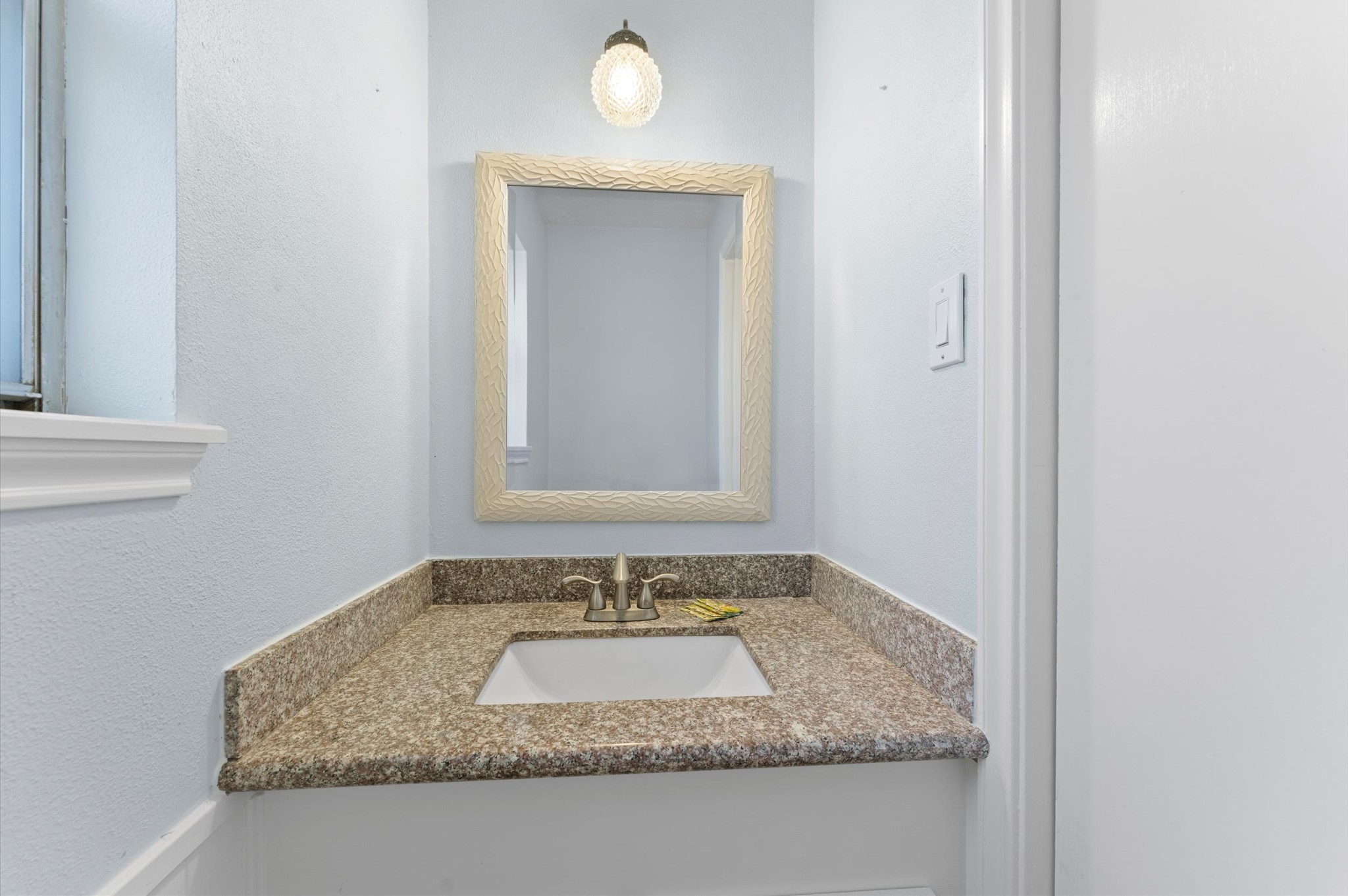 19415 Craigchester Lane Spring, TX 77388 - Photo 21 of 31 a bathroom with a granite countertop sink and a mirror