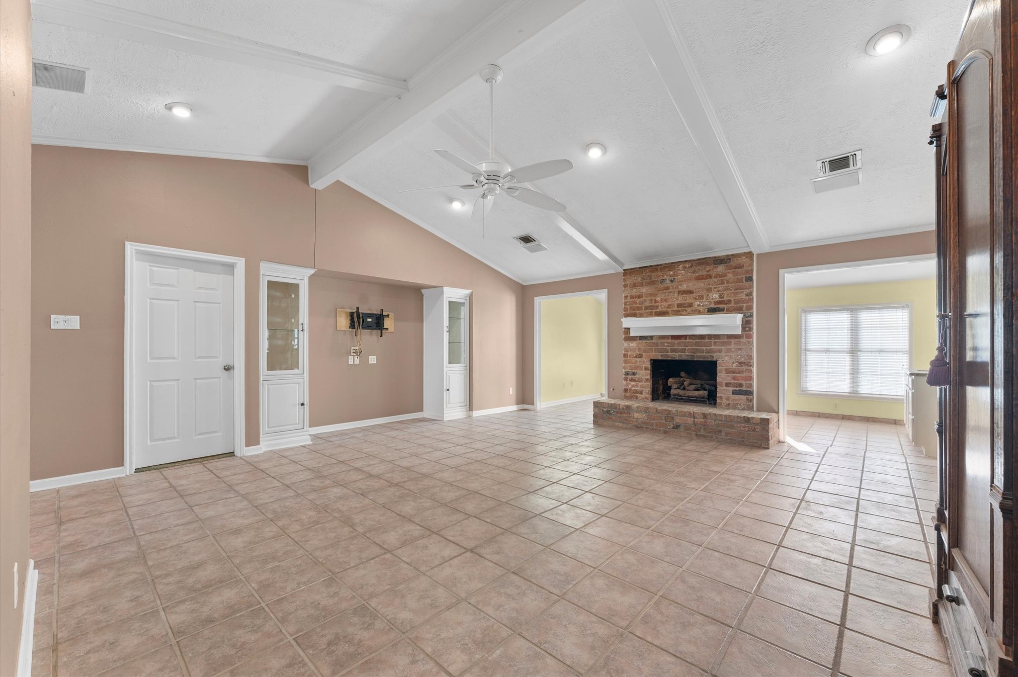 19415 Craigchester Lane Spring, TX 77388 - Photo 6 of 31 a view of an empty room with a fireplace and a window