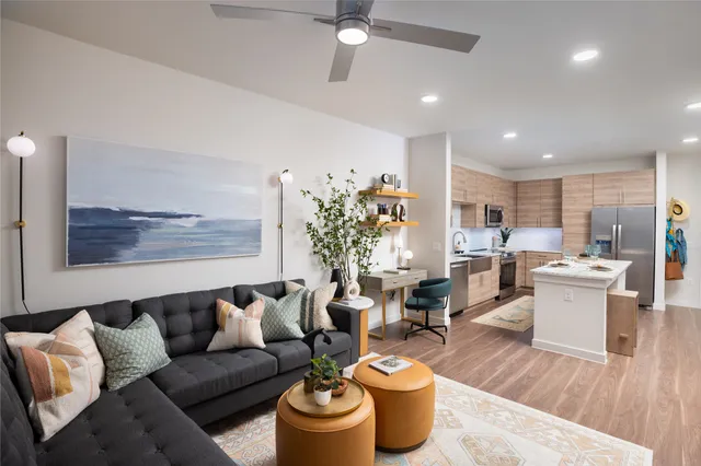 a living room with furniture or wooden floor and a potted plant