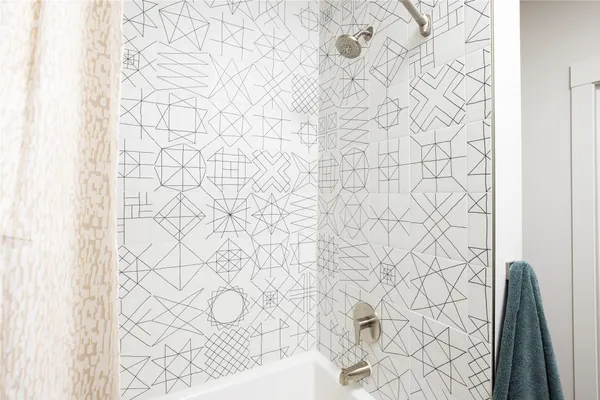 a bathroom with a shower curtain and a shower curtain