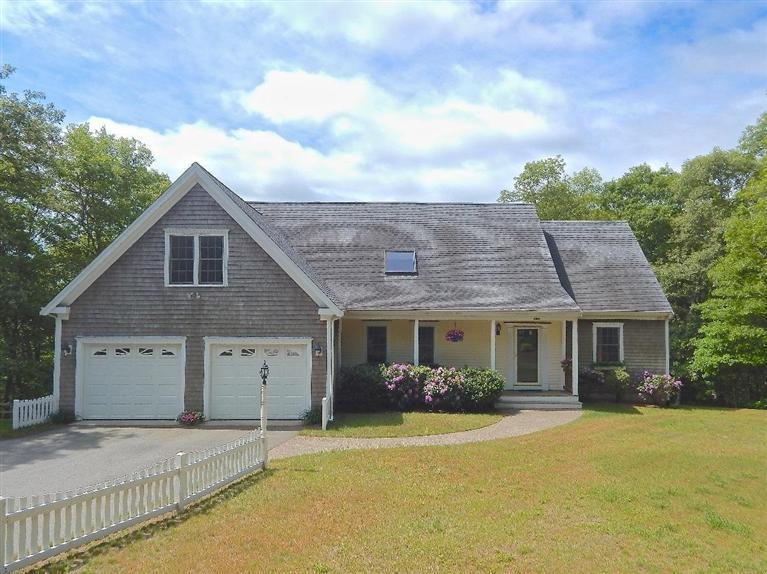 367 Service Road Sandwich, MA 02537 - Photo 1 of 34 a front view of a house with a garden