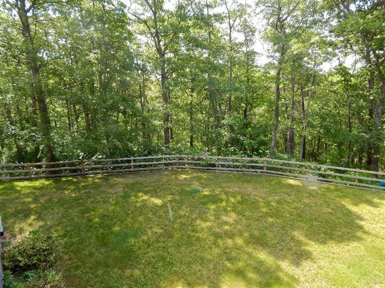 367 Service Road Sandwich, MA 02537 - Photo 11 of 34 a view of a swimming pool with a yard