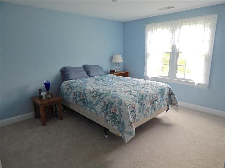 367 Service Road Sandwich, MA 02537 - Photo 26 of 34 a bedroom with a bed and a window