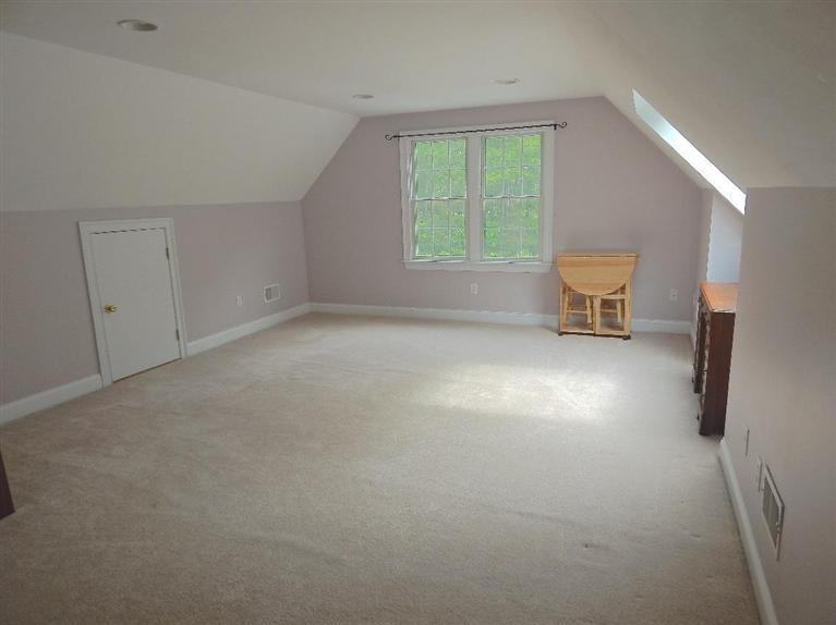 367 Service Road Sandwich, MA 02537 - Photo 28 of 34 an empty room with a fireplace and a window