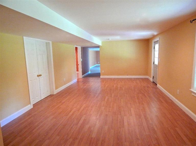 367 Service Road Sandwich, MA 02537 - Photo 29 of 34 wooden floor in an empty room with a window