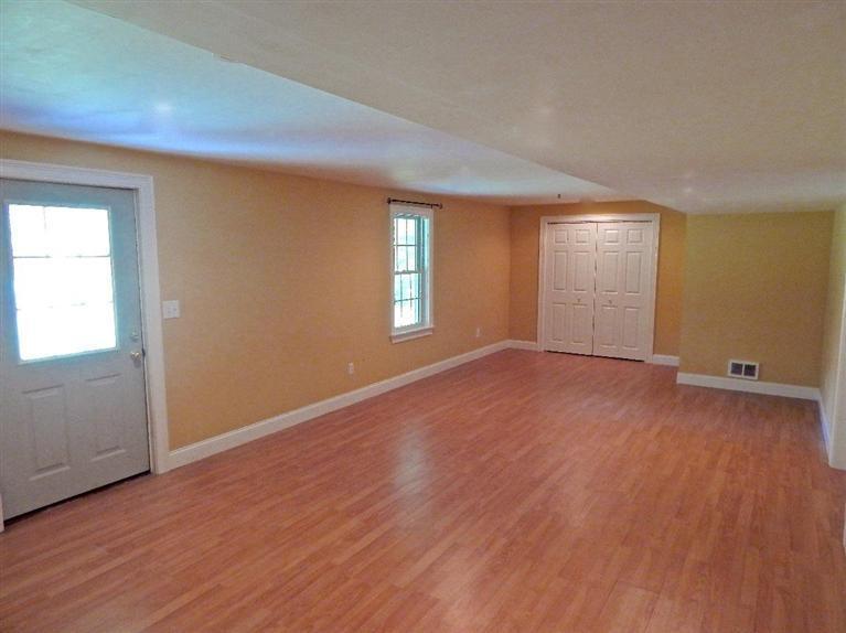 367 Service Road Sandwich, MA 02537 - Photo 33 of 34 an empty room with wooden floor and windows