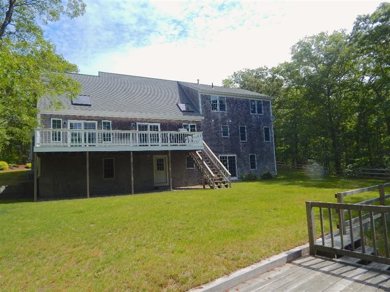 367 Service Road Sandwich, MA 02537 - Photo 4 of 34 a view of a house with a swimming pool