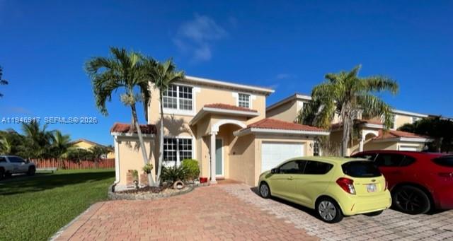 2530 Southwest 153rd Pass Miami, FL 33185 - Photo 2 of 8 a car parked in front of a house
