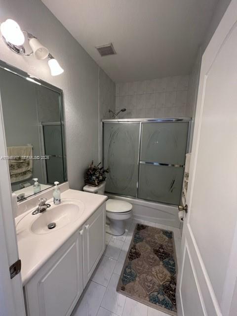 2530 Southwest 153rd Pass Miami, FL 33185 - Photo 7 of 8 a bathroom with a sink a toilet and shower