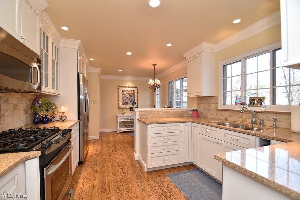 23967 Wimbledon Road Shaker Heights, OH 44122 - Photo 14 of 35 Cook's kitchen boasts granite counters and stainless appliances