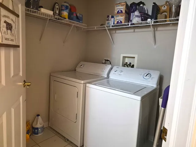 a utility room with dryer and washer