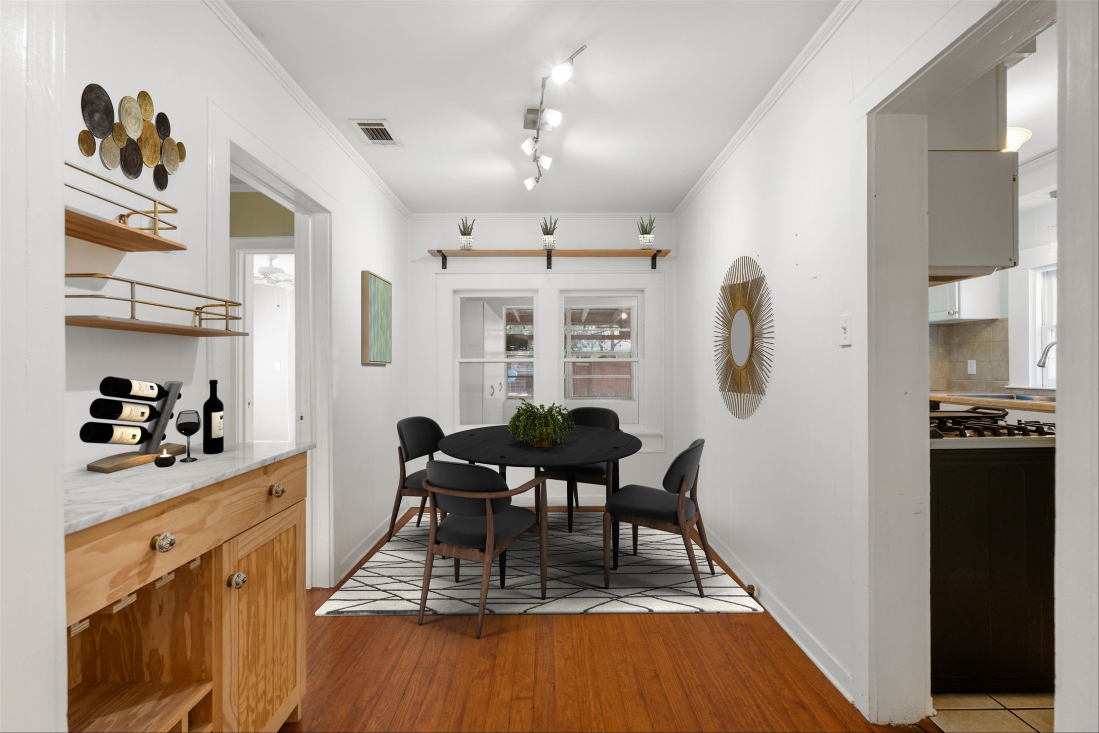 1218 South Myrtle Street Georgetown, TX 78626 - Photo 13 of 37 Virtually Staged dining space featuring crown molding, light wood-type flooring, and track lighting