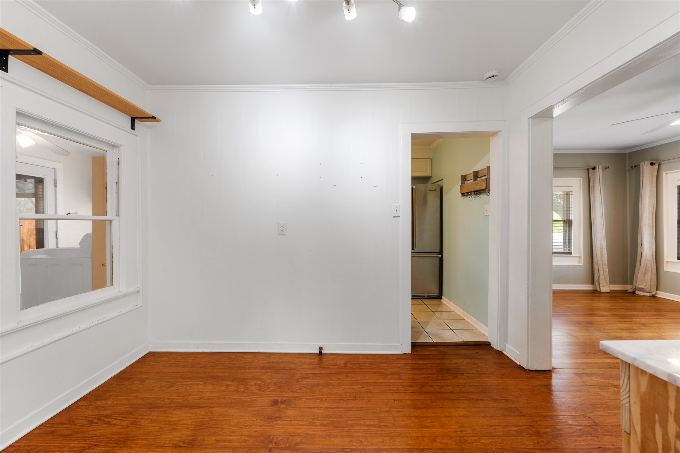 1218 South Myrtle Street Georgetown, TX 78626 - Photo 16 of 37 Dining room with wood-type flooring, ornamental molding, and ceiling fan
