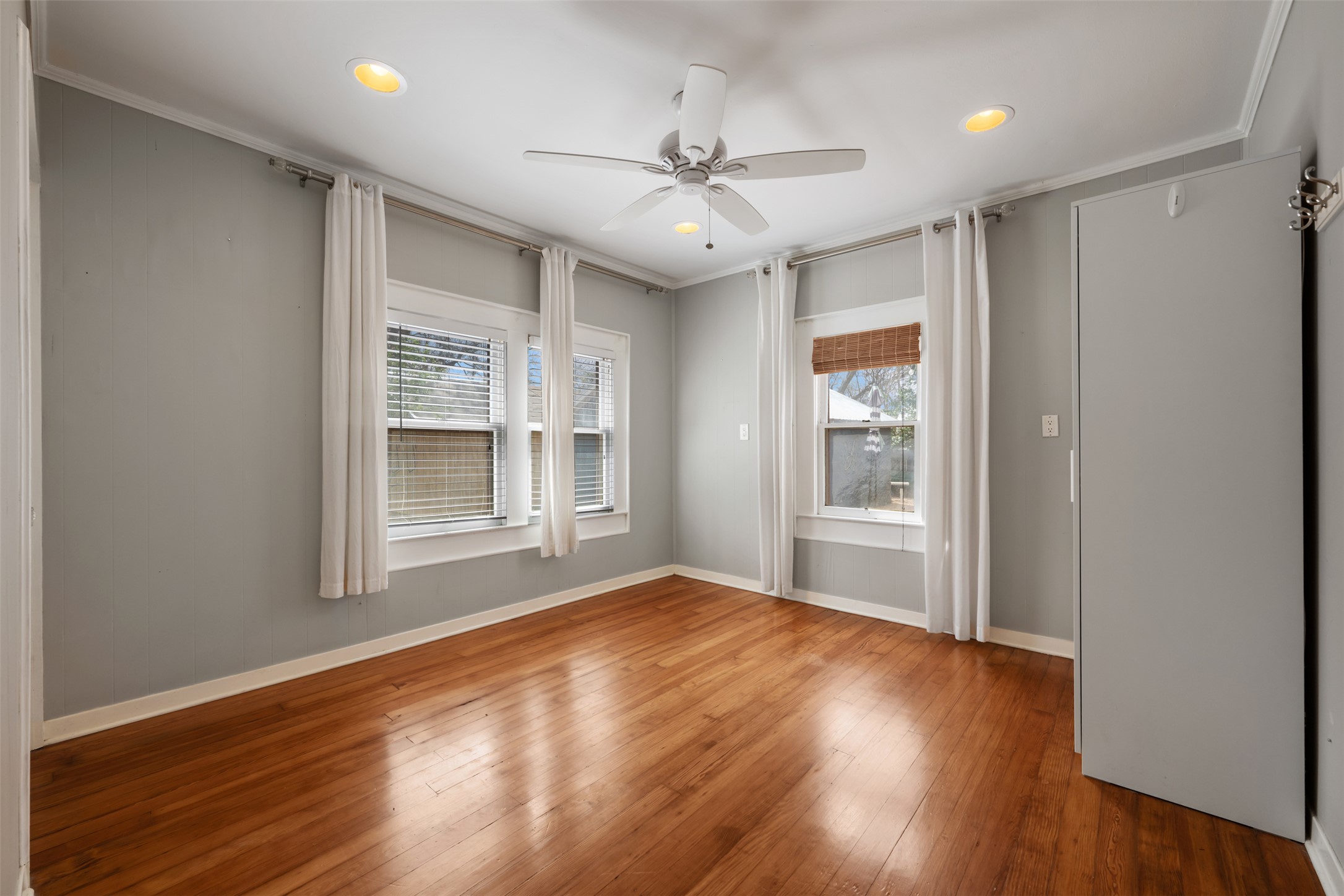 1218 South Myrtle Street Georgetown, TX 78626 - Photo 26 of 37 Bedroom featuring wood-type flooring, ceiling fan, and recessed lighting