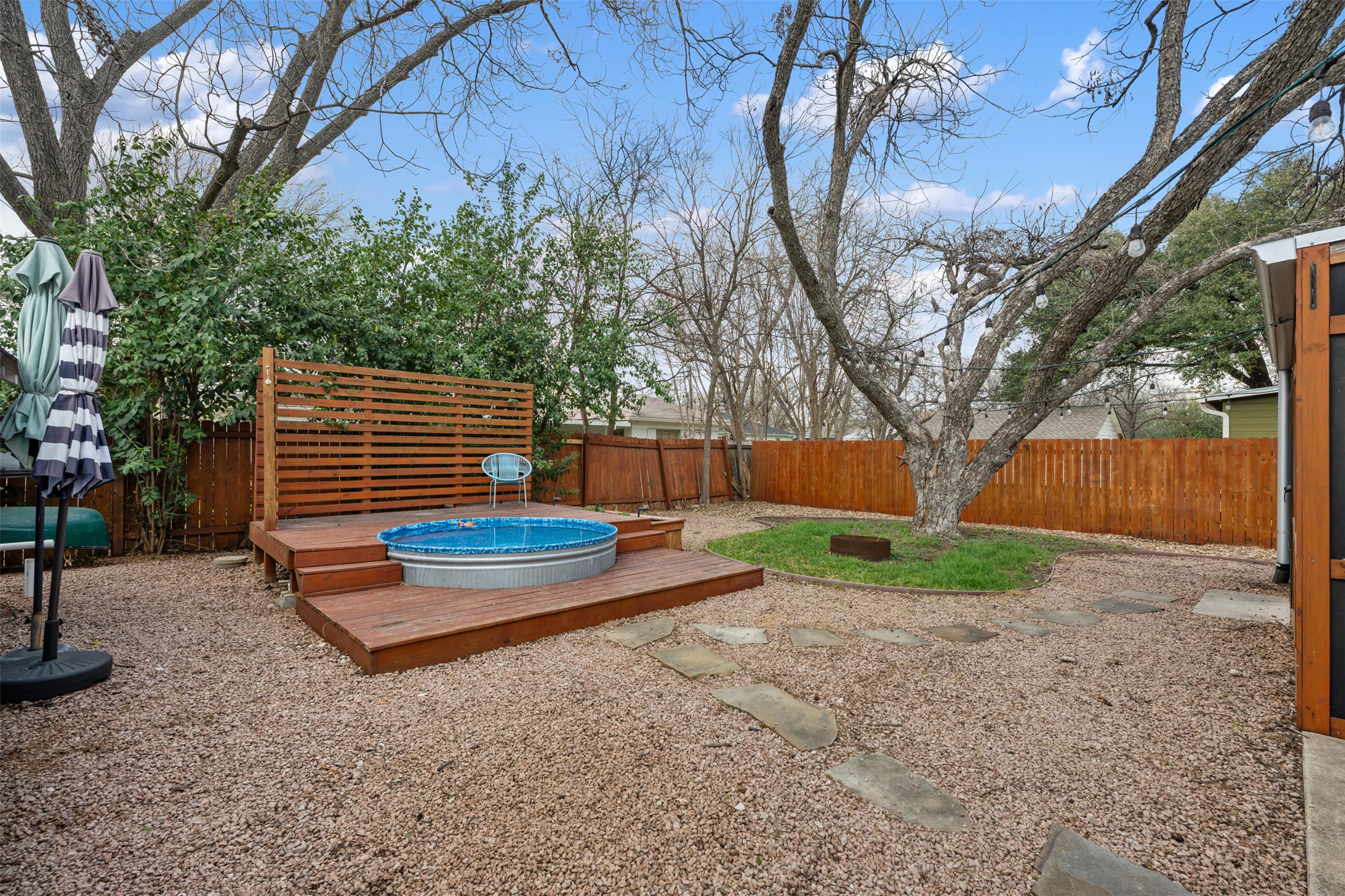 1218 South Myrtle Street Georgetown, TX 78626 - Photo 32 of 37 Fenced backyard with a wooden deck and a jacuzzi