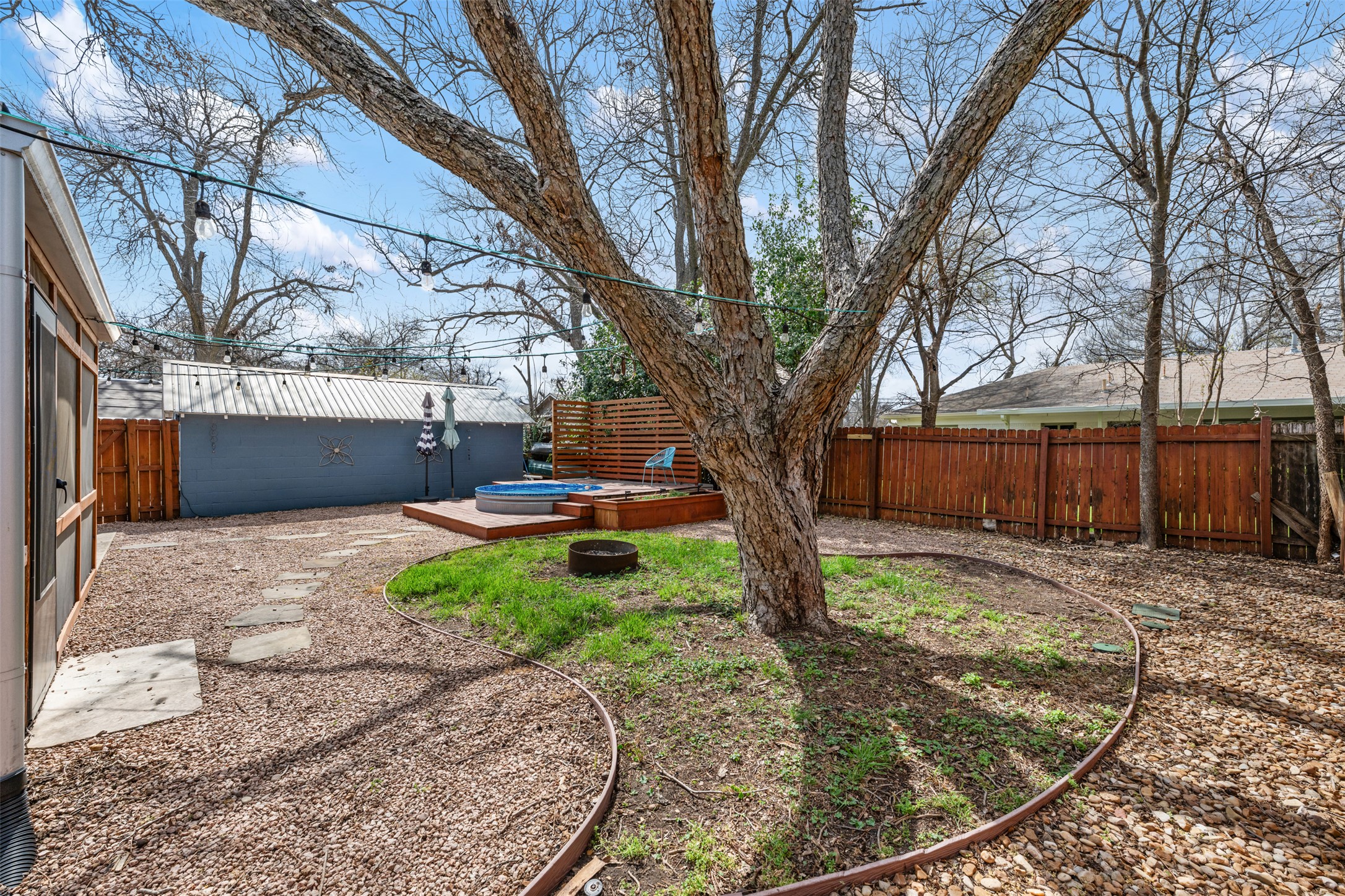 1218 South Myrtle Street Georgetown, TX 78626 - Photo 37 of 37 Fenced backyard featuring a hot tub and a patio