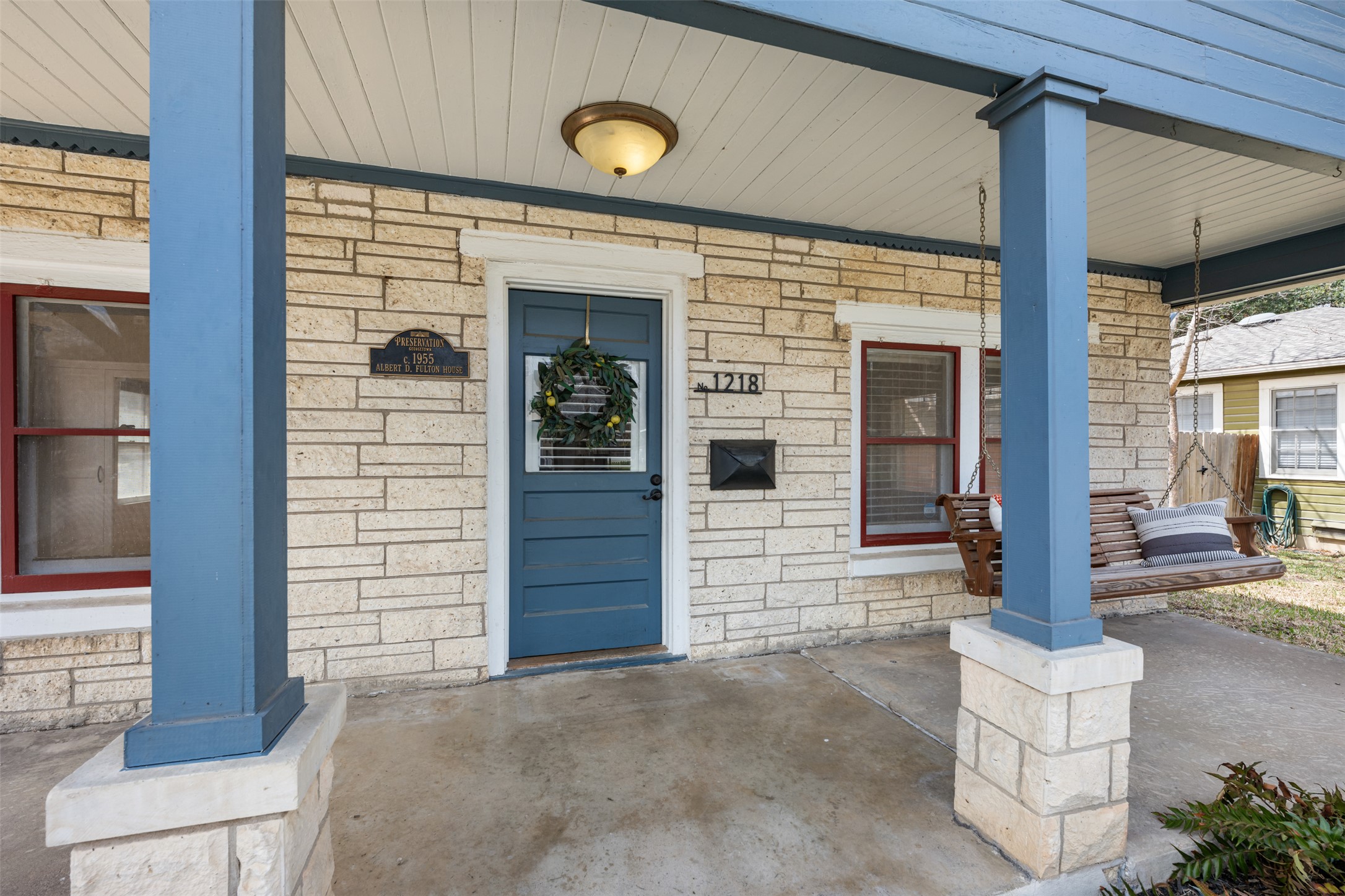 1218 South Myrtle Street Georgetown, TX 78626 - Photo 6 of 37 Doorway to property featuring covered porch and stone siding