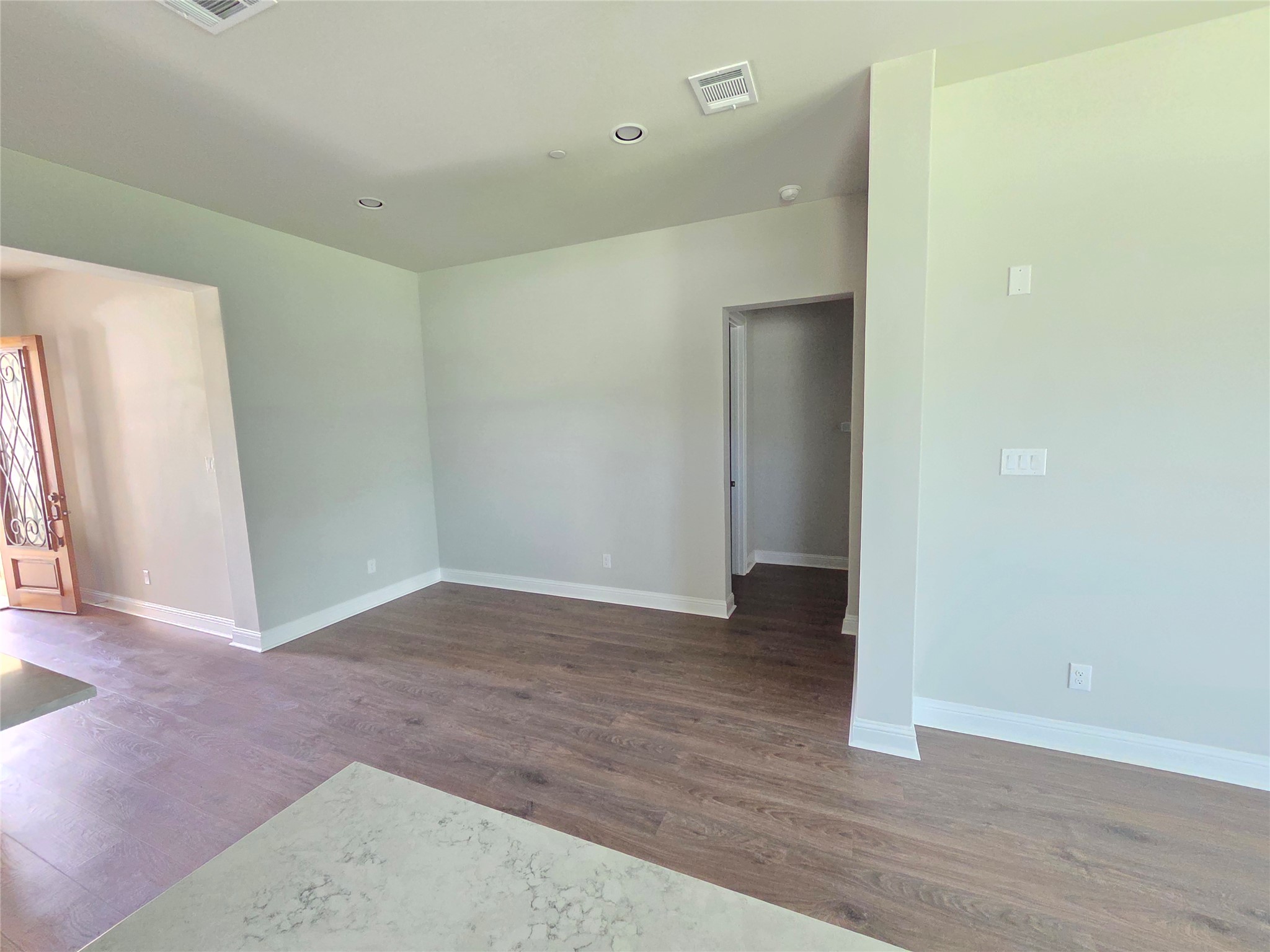 600 C-Bar Ranch Trail, Unit 121 Cedar Park, TX 78613 - Photo 12 of 32 Hardwood-style flooring and recessed lighting define this inviting open living space.