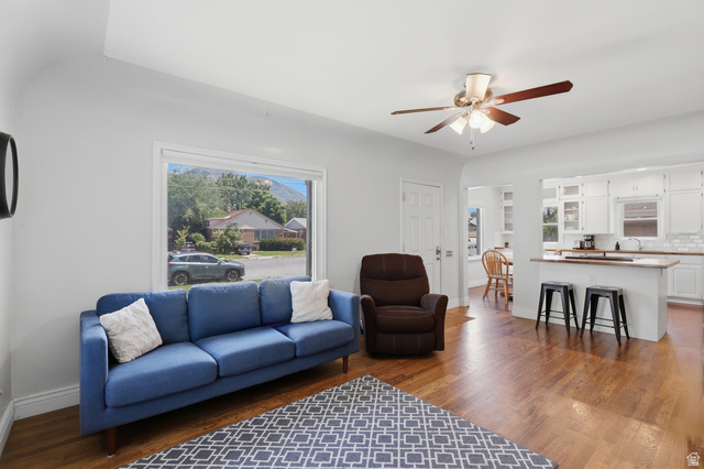 85 North 800 West Provo, UT 84601 - Photo 3 of 25 Bright living area featuring wood-finish flooring, a large picture window, and a ceiling fan