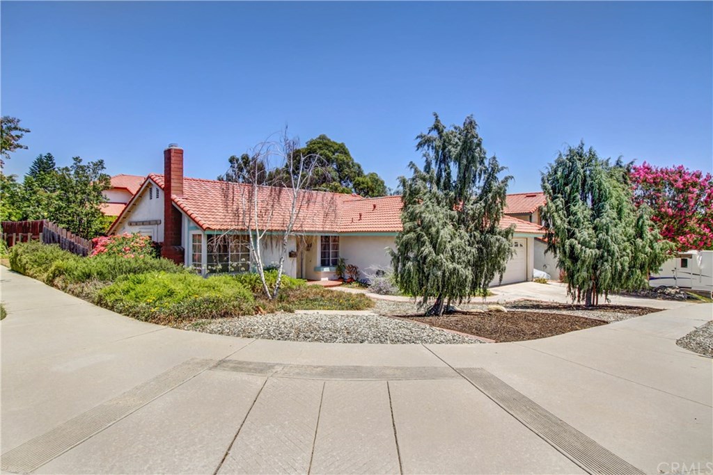 7529 Everest Place Rancho Cucamonga, CA 91730 - Photo 1 of 1 a front view of a house with a yard and potted plants