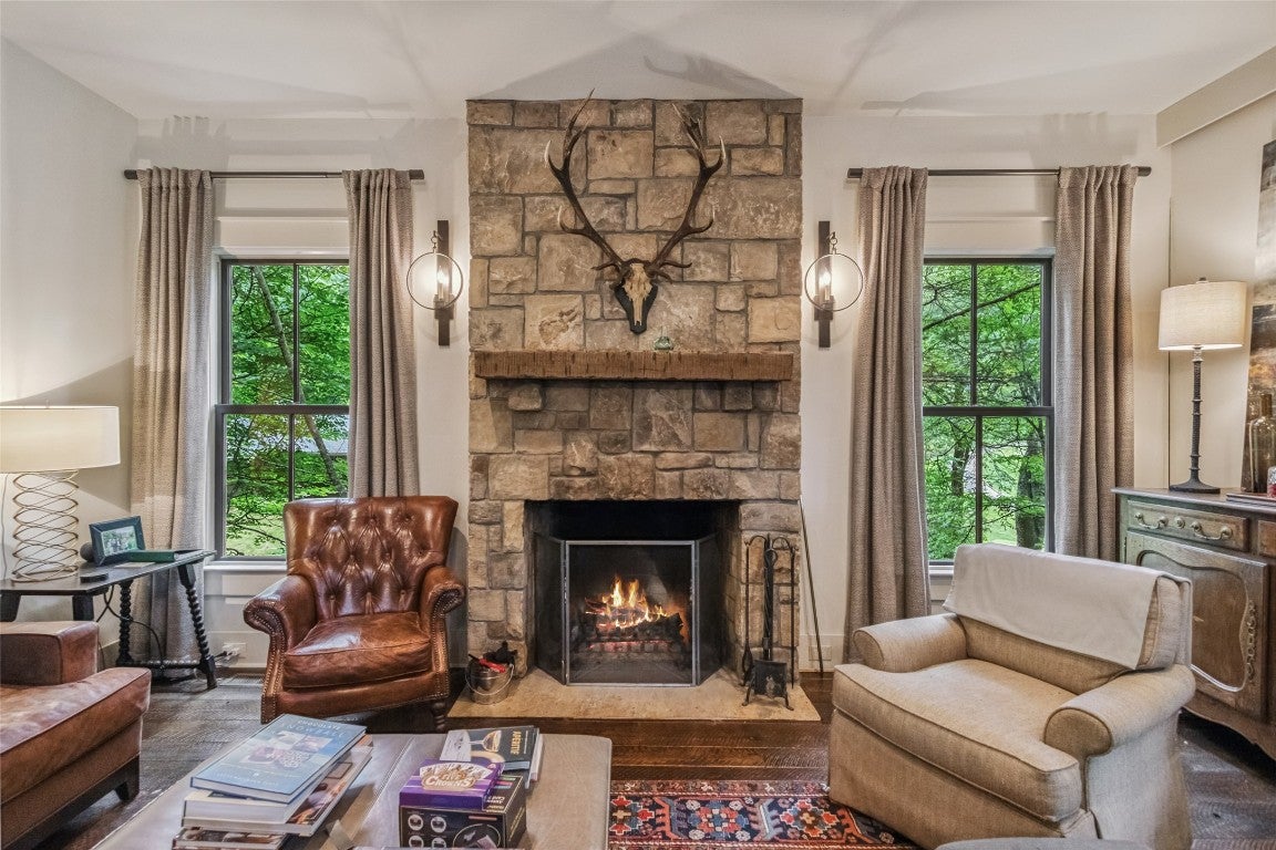 804 Moorewood Road Highlands, NC 28741 - Photo 13 of 54 Stone Fireplace in the focal point of the sitting area