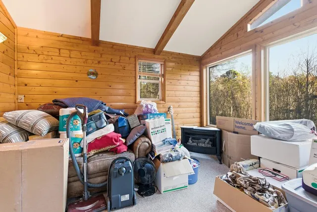 a bedroom with furniture and a window