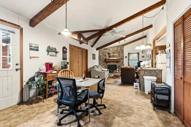 a view of a livingroom with furniture and a window