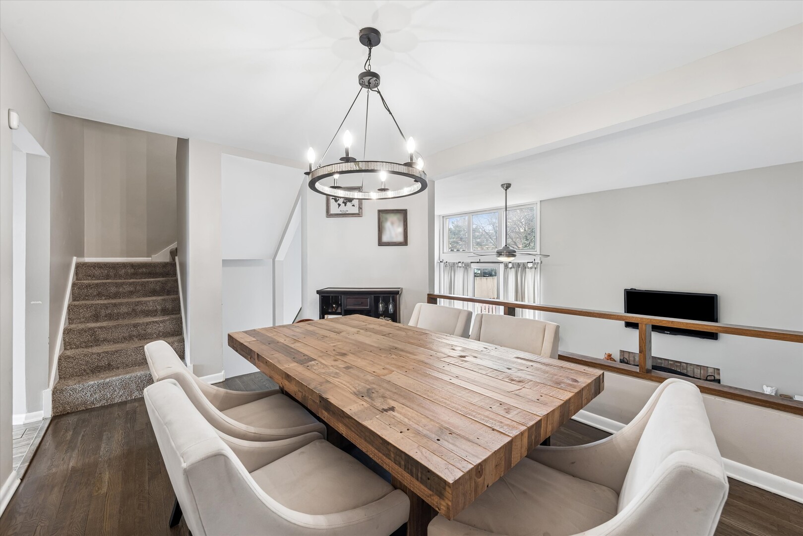 20 Oak Tree Court, Unit 20 Elmhurst, IL 60126 - Photo 13 of 35 a living room with a table chairs and a wooden floor