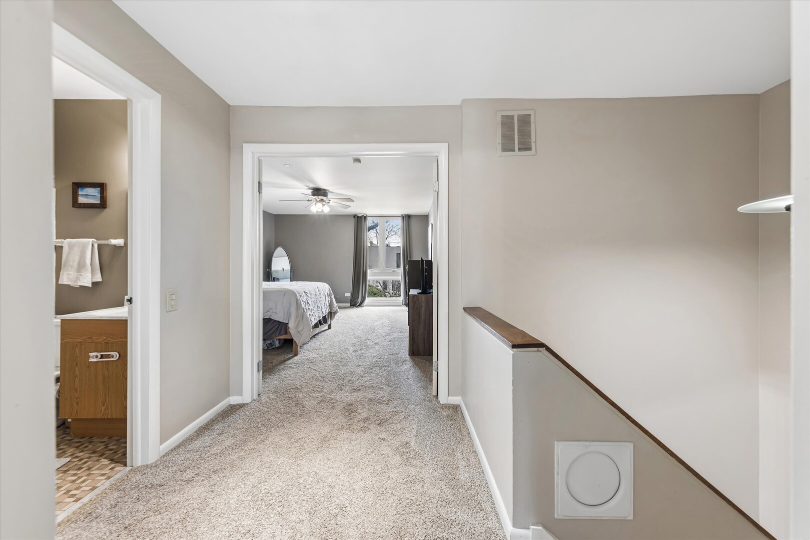 20 Oak Tree Court, Unit 20 Elmhurst, IL 60126 - Photo 18 of 35 a view of a hallway with wooden floor and staircase