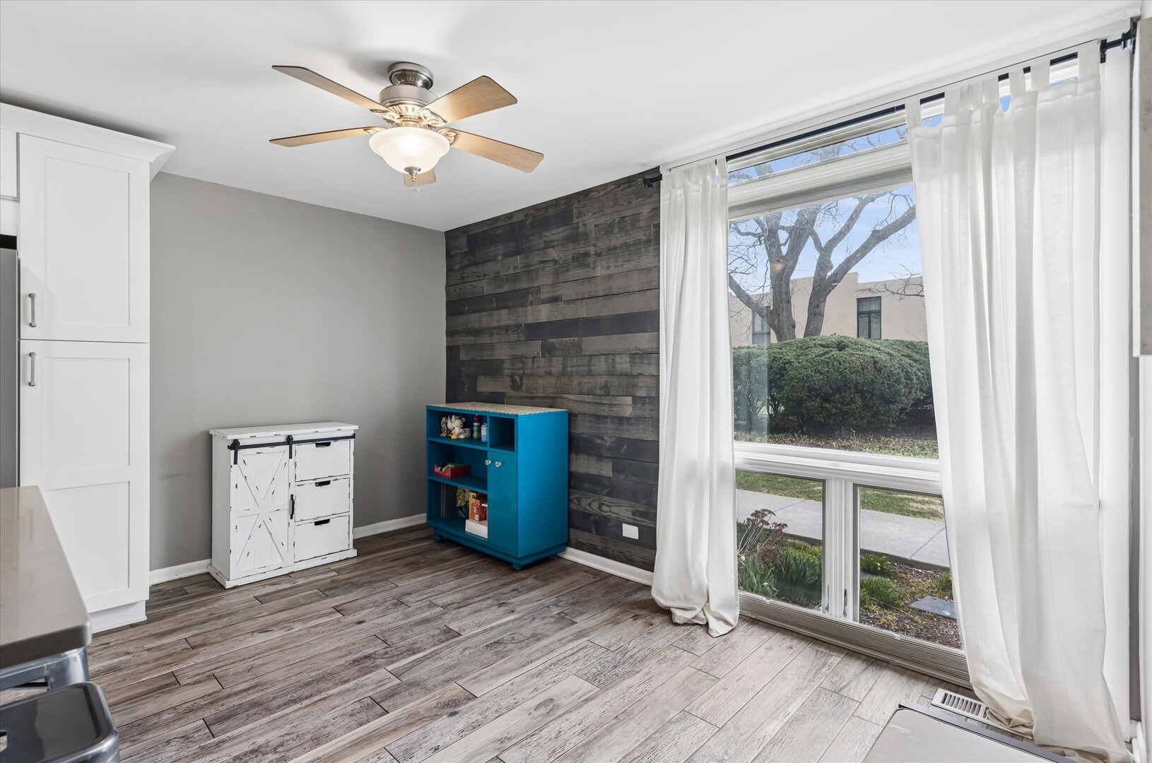 20 Oak Tree Court, Unit 20 Elmhurst, IL 60126 - Photo 10 of 35 a view of an empty room with a window and kitchen view